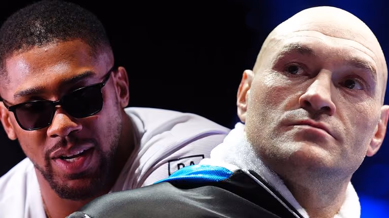 Anthony Joshua in sunglasses and Tyson Fury in a close-up at a press event